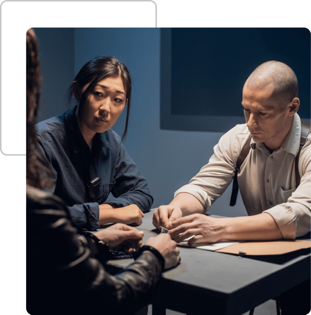 A group of people sitting around a table.