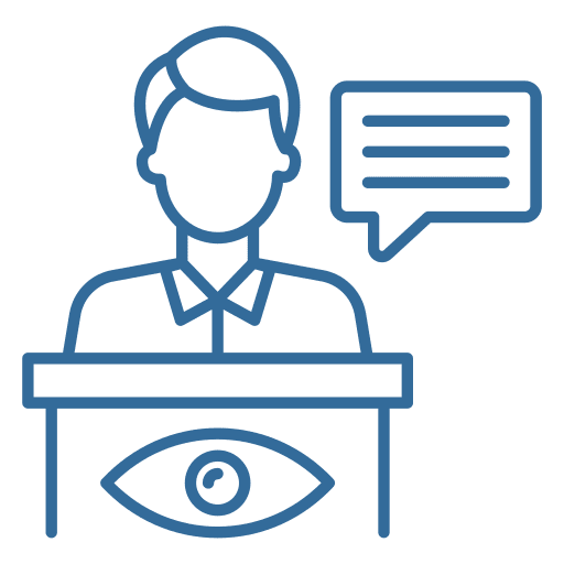 A person is sitting at a table with an eye on the table.